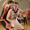 Isaac Mangrum, right, of Pea Ridge drives to the basket under pressure from Gravette’s Otto Troutner...
