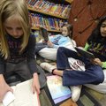 Emily Hornick, 8, from left, Madison Rector, 8, and Neha Soman, 9, all third-graders, read books the...