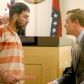 Timothy Swinford talks with public defender Tyler Benson in the courtroom Wednesday at the Washingto...