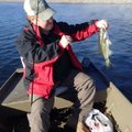Stroud shows the bass he caught with a plastic worm. 