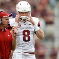 NWA Media/JASON IVESTER -- Arkansas offensive coordinator Paul Petrino talks to quarterback Tyler Wi...