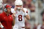 NWA Media/JASON IVESTER -- Arkansas offensive coordinator Paul Petrino talks to quarterback Tyler Wilson during the second quarter against Texas A&M on Saturday, Sept. 29, 2012, at Kyle Field in College Station, Texas.