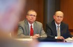 Arkansas Athletic Director Jeff Long (left) and Donald Pederson, vice chancellor for finance and administration, answer questions concerning expansion plans to Reynolds Razorback Stadium at a meeting of the UA board of trustees Thursday. 