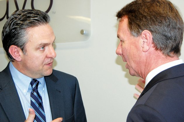 richard-howe-of-little-rock-left-chairman-and-ceo-of-inuvo-an-internet-marketing-and-technology-company-talks-with-conway-mayor-tab-townsell-after-an-announcement-that-inuvo-will-move-its-headquarters-from-new-york-to-conway-creating-50-jobs-a-third-of-the-jobs-will-be-filled-by-employees-transferred-from-elsewhere-the-remainder-will-be-hired-in-arkansas-officials-said