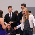 Aubrey Edie, 17, right, reacts Thursday as Logan Dallas approaches to pin on a mum after Edie was cr...