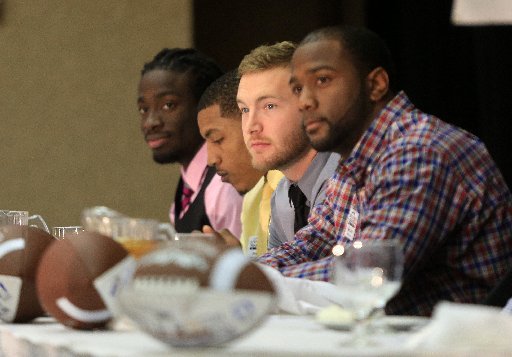 award-winners-left-to-right-jimmy-jean-of-arkansas-baptist-jamal-nixon-of-the-university-of-arkansas-monticello-tanner-marsh-of-arkansas-tech-and-kelvin-martin-of-harding-listen-to-introductions-friday-afternoon-during-the-little-rock-touchdown-club-awards-banquet