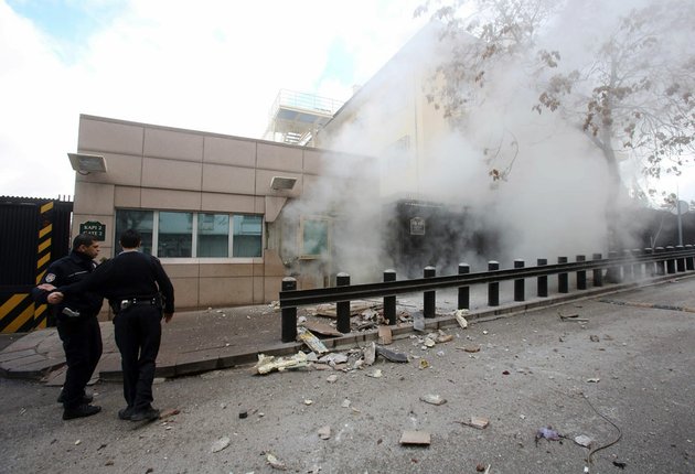 two-police-officers-arrive-at-gate-2-of-the-us-embassy-just-minutes-after-a-suicide-bomber-has-detonated-an-explosive-device-at-the-entrance-of-the-us-embassy-in-the-turkish-capital-ankara-turkey-on-friday-feb-1-2013