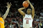 NWA Media/MICHAEL WOODS --02/02/2013-- Arkansas guard BJ Young pulls up for a three-point shot during the second half of Saturday afternoon's game against Tennessee at Bud Walton Arena in Fayetteville.
