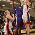 Fayetteville’s Brittany Austin, center, shoots while being pressured by Rogers Heritage’s Lacey Murr...