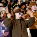 Alauna Lundien, 8, and other third-graders perform Friday during the Groundhog Day assembly at Bonni...
