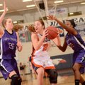 Ashley Ward, center, of Rogers Heritage looks to pass the ball Friday under pressure from Fayettevil...