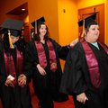 University of Phoenix graduates Khanthary Singnhoth, from left, Christina Andrews and Sarah Brown ma...