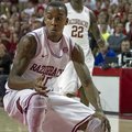 Arkansas' BJ Young (11) prepares to spin to the hoop during the first half an NCAA college basketbal...