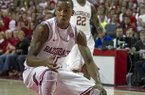 Arkansas' BJ Young (11) prepares to spin to the hoop during the first half an NCAA college basketball game against Tennessee in Fayetteville, Ark., Saturday, Feb. 2, 2013. Arkansas defeated Tennessee 73-60. (AP Photo/Gareth Patterson)