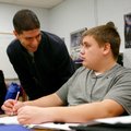 Ryan Malashock, left, Oakdale Middle School history teacher, talks Friday with eighth-grader Jayson ...