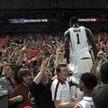 NWA MEDIA/SAMANTHA BAKER -- Arkansas' Mardracus Wade climbs into the stands after the Razorbacks bea...