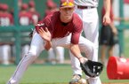 NWA Media/ANDY SHUPE -- Arkansas infielder Dominic Ficociello fields a ball Friday, Sept. 7, 2012, during the Razorbacks' first practice of the season at Baum Stadium.