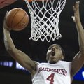 Arkansas' Coty Clarke (4) dunks during the second half an NCAA college basketball game against No. 2...