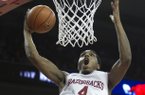 Arkansas' Coty Clarke (4) dunks during the second half an NCAA college basketball game against No. 2 Florida in Fayetteville, Ark., Tuesday Feb. 5, 2013. Arkansas won 80-69. (AP Photo/Gareth Patterson)