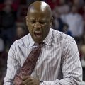 Arkansas' head coach Mike Anderson celebrates after a foul call during the second half an NCAA colle...