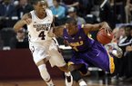 LSU guard Anthony Hickey (1) pushes past Mississippi State guard Trivante Bloodman (4) during the second half of an NCAA college basketball game in Starkville, Miss., Saturday, Feb. 2, 2013. LSU won 69-68. (AP Photo/Rogelio V. Solis)
