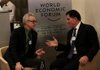 Michael Dell, chairman and chief executive officer of Dell Inc., right, speaks with a fellow delegate on day three of the World Economic Forum (WEF) in Davos, Switzerland, on Friday, Jan. 25, 2013. World leaders, influential executives, bankers and policy makers attend the 43rd annual meeting of the World Economic Forum in Davos, the five day event runs from Jan. 23-27. Photographer: Chris Ratcliffe/Bloomberg *** Local Caption *** Michael Dell