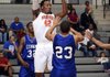Arkansas Democrat-Gazette/KAREN E. SEGRAVE -- 2/5/13 -- Little Rock Hall's Roy Owens (42) looks to pass the ball under coverage from Conway's Adrian Moore (32) and Sean Criswell (23) early in the first half Tuesday night at Hall High School
