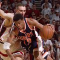Auburn's Bryant Smith (13) drives the lane as Arkansas' Pat Bradley, left, guards him during the sec...