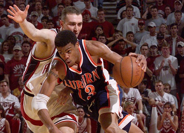 auburns-bryant-smith-13-drives-the-lane-as-arkansas-pat-bradley-left-guards-him-during-the-second-half-wednesday-feb-24-1999-in-bud-walton-arena-in-fayetteville-ark-arkansas-won-104-88-ap-photogary-yandell
