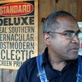 Amos Paul Kennedy Jr., shown here with one of his prints, will offer a lecture and workshop at the U...