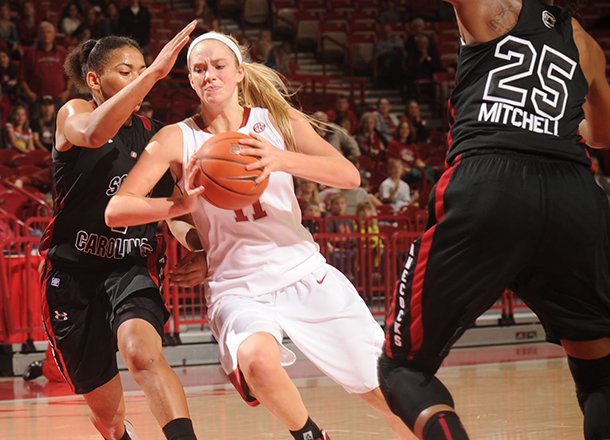 arkansas-sophomore-guard-calli-berna-center-drives-with-the-basketball-as-south-carolina-senior-guard-ieasia-walker-left-and-freshman-guard-tiffany-mitchell-right-defend-during-the-second-half-sunday-jan-27-2013-in-bud-walton-arena