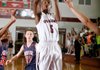 Tereke Eckwood, a Springdale sophomore, puts up a shot in the lane against Rogers Heritage during Tuesday’s game at Springdale. 