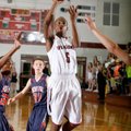 Tereke Eckwood, a Springdale sophomore, puts up a shot in the lane against Rogers Heritage during Tu...