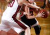 Ashley Ward of Rogers Heritage tries to get around Springdale’s Ashley Dederich on Tuesday in Springdale. 