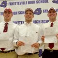 Fayetteville High students (left to right) Brooks Ellis, Alex Brignoni and Austin Allen get ready to...