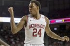 Arkansas' Michael Qualls argues a call during the first half an NCAA college basketball game against Florida in Fayetteville, Ark., Tuesday Feb. 5, 2013. (AP Photo/Gareth Patterson)