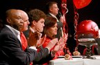Pulaski Academy's tight end Hunter Henry, center, applauded as his coach Kevin Kelley, upper right speaks during a signing ceremony at the school Wednesday afternoon in Little Rock. From left is Henry family friend and former coach Walter Jordan, father Mark Henry his mother Jenny Henry.
