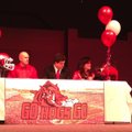 Hunter Henry (center) prepares to sign with the Razorbacks on National Signing Day, Feb. 6, 2013.