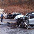 An Arkansas State Police trooper looks at the aftermath of an early morning accident which killed on...