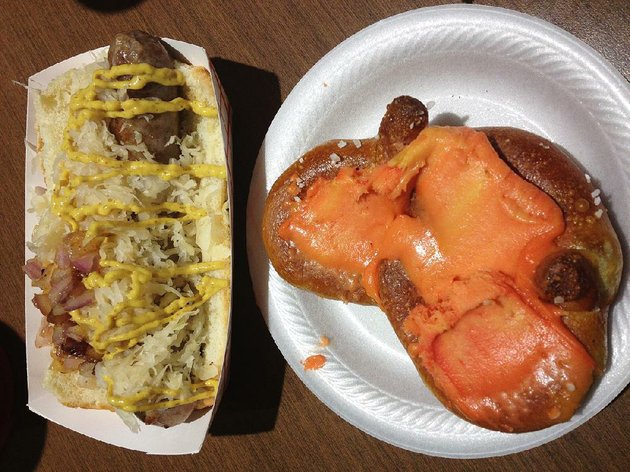 pretzel-with-port-wine-cheese-spread-and-a-bratwurst-with-sauerkraut-grilled-onions-and-mustard-at-mr-dunderbaks