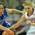 Kentucky defender Jennifer O'Neill knocks the ball away from Arkansas' Erin Gatling during the first...