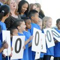Harp Elementary School students laugh while taking pictures Wednesday during a celebration of the Ro...