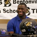 Bentonville’s Tearris Wallace laughs during a letter of intent signing ceremony inside the Tiger Ath...