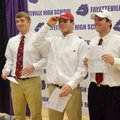 Brooks Ellis, from left, Alex Brignoni and Austin Allen, all Fayetteville High School students, pose...
