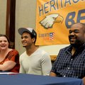 Forrest Johnson, center, a Rogers Heritage wide receiver, laughs with his parents, Tracy, left, and ...