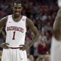 Arkansas' Mardracus Wade (1) smiles after a made free-throw during the first half an NCAA college ba...