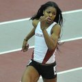 University of Arkansas runner Regina George runs the final turn in the women's 400 M Invitational at...