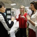 Sheilah Roenfeldt, above from left, a Science Fair judge from Fayetteville discusses plant growth Th...