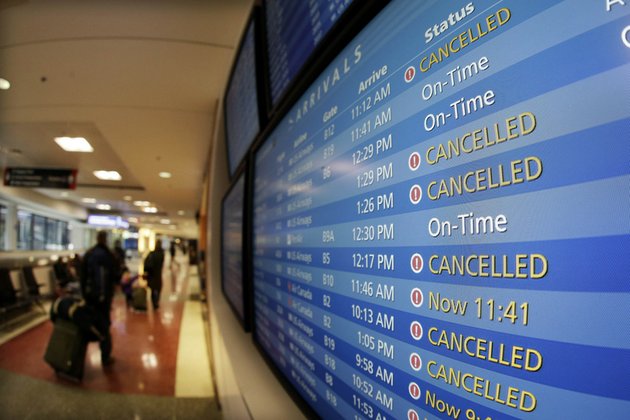 tv-monitors-at-logan-international-airport-in-boston-show-cancelled-flights-friday-morning-feb-8-2013