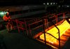 A slab of steel moves along a production line during the “hot rolling” process at ThyssenKrupp AG’s steel mill in Duisburg, Germany. ThyssenKrupp said Friday it plans to cut more than 2,000 jobs in Europe. 